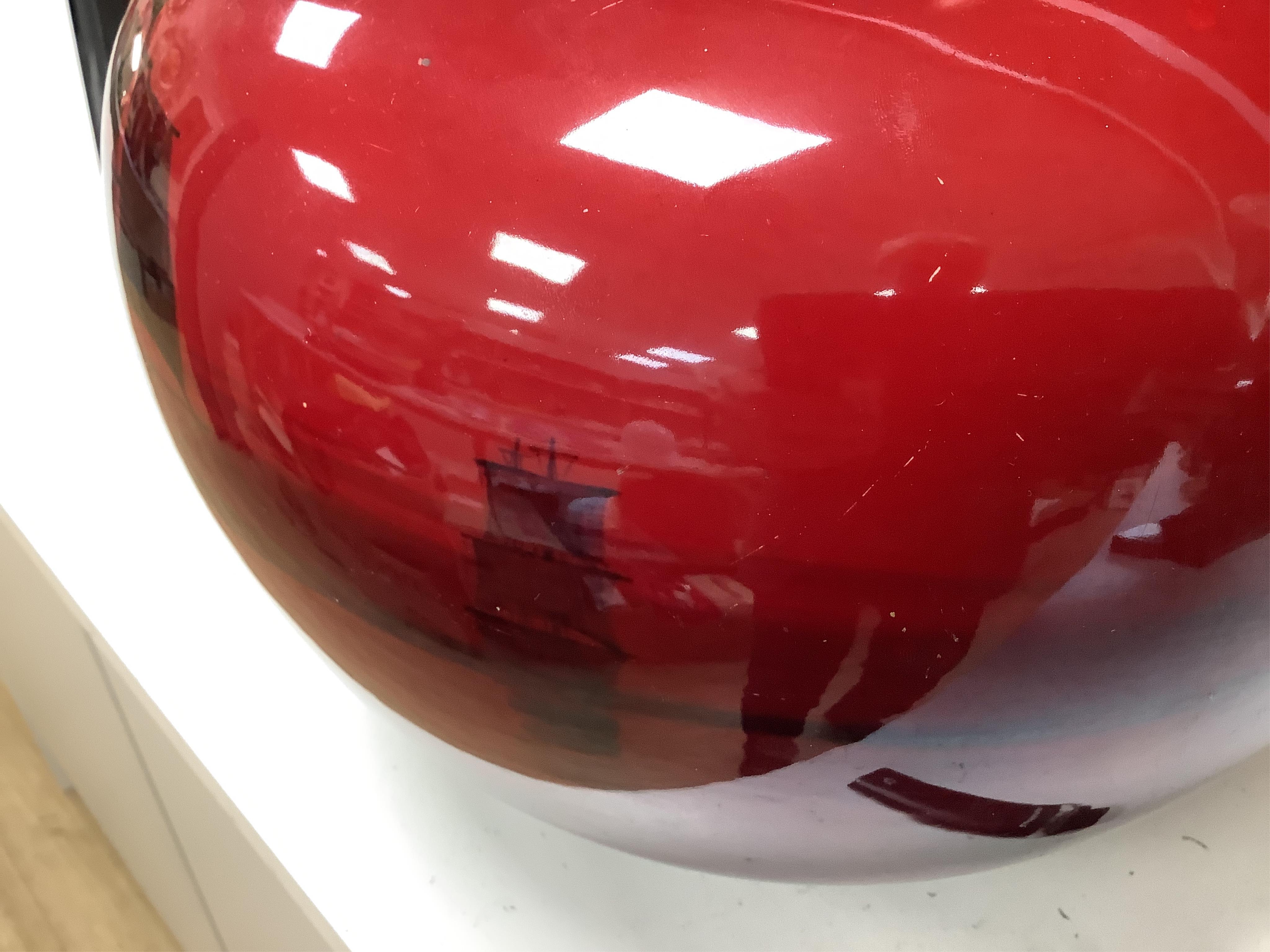 A large Doulton flambe vase decorated with ships, 29cm high